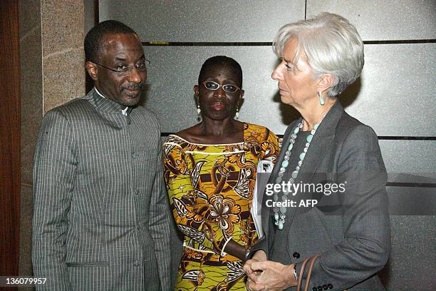 International Monetary Fund Managing Director Christine Lagarde speaks with Nigerian Central Bank Governor Lamido Sanusi Lamido and the director...