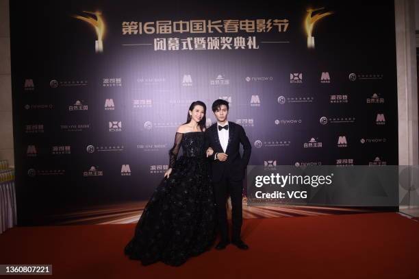 Actress Ada Choi Siu-fan and her husband Max Zhang Jin attend the closing ceremony of 16th Changchun Film Festival on December 25, 2021 in Changchun,...