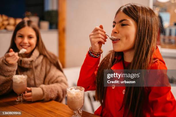 little girls drinking hot chocolate - cocoa stock pictures, royalty-free photos & images