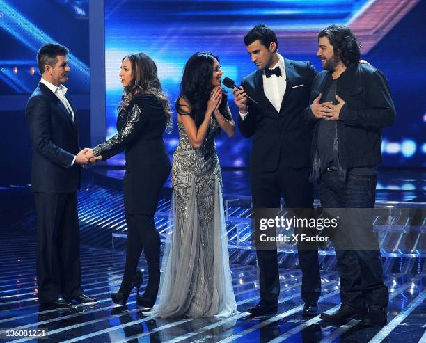 Judge Simon Cowell, winning contestant Melanie Amaro, judge Nicole Scherzinger, host Steve Jones and finalist Josh Krajcik onstage at FOX's 'The X...