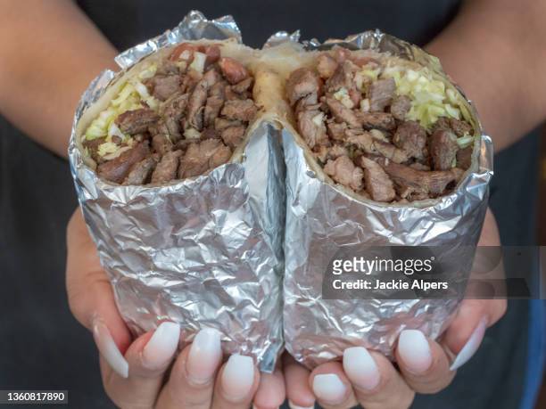 carne asada burrito wrapped in foil - wrapped burrito stock pictures, royalty-free photos & images