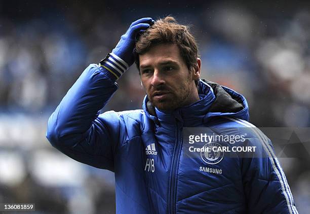 Chelsea's Portuguese manager Andre Villas-Boas sctratches his head during an open training session at Stamford Bridge in London on on December 19,...