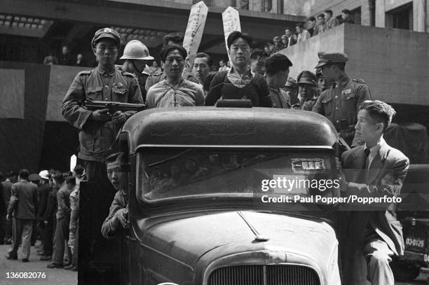 Prisoners en route along Shanghai streets to their execution ground, condemned to death for economic racketeering, circa May 1949. The prisoners are...