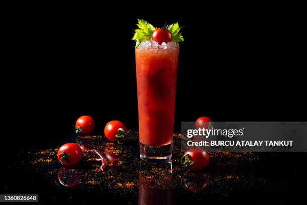 bloody mary cocktail on black background - bloody mary stock pictures, royalty-free photos & images