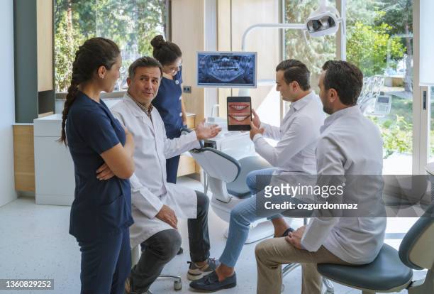 medical dentist team working in the dental clinic - dentist office stock pictures, royalty-free photos & images
