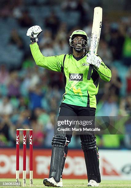 Chris Gayle of the Thunder celebrates getting a century during the T20 Big Bash League match between the Sydney Thunder and the Adelaide Strikers at...