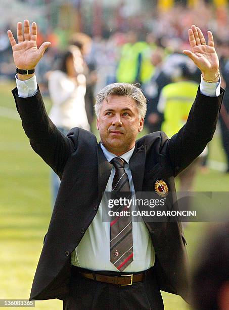 Milan's coach Carlo Ancelotti celebrates with his fans after their Italian Serie A football match against Brescia at San Siro stadium in Milan, 16...