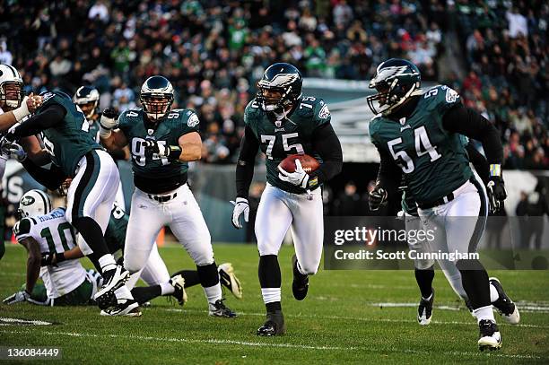 Juqua Parker of the Philadelphia Eagles runs for a touchdown against the New York Jets at Lincoln Financial Field on December 18, 2011 in...