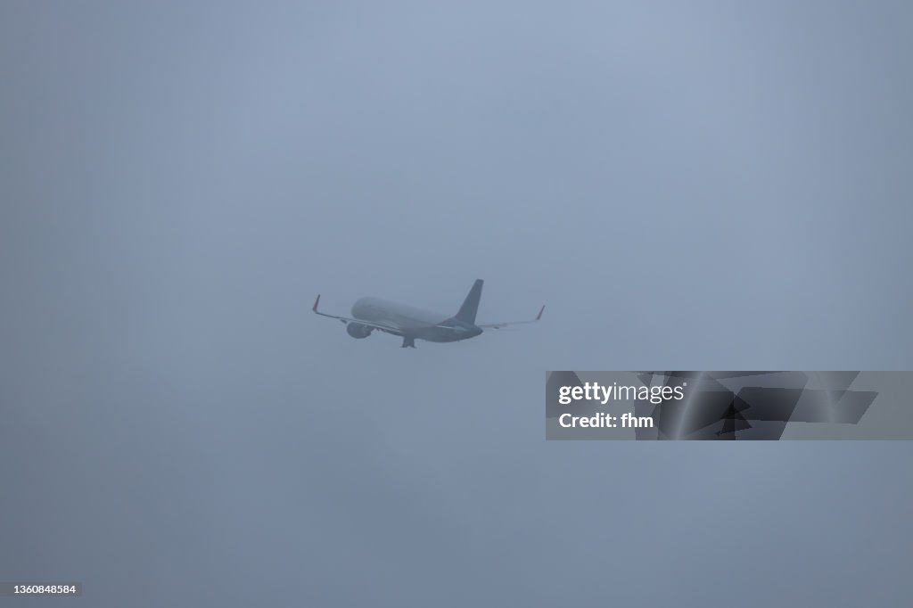 Passenger plane takes off in the fog