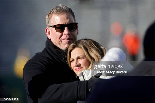 Troy Aikman and Erin Andrews meet before the game between the Cleveland Browns and the Green Bay Packers at Lambeau Field on December 25, 2021 in...