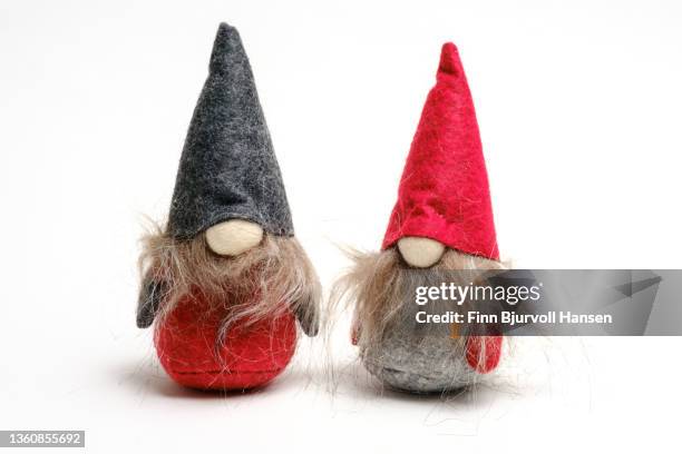 two goblins with colorful hats. isolated against a white background - finn bjurvoll stock pictures, royalty-free photos & images