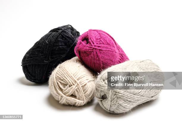 four bundles of knitting yarn in different colors. isolated against a white background - finn bjurvoll imagens e fotografias de stock