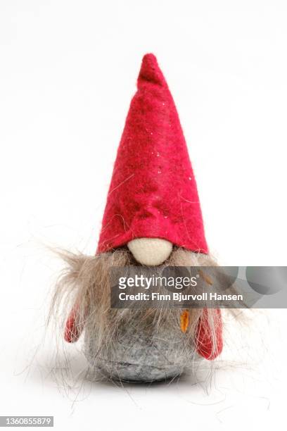 goblin with red hat. isolated against a white background - finn bjurvoll stock pictures, royalty-free photos & images