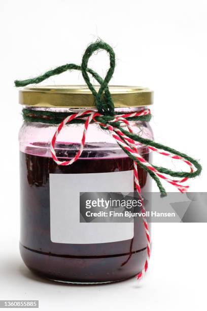 jar of pickled beets. decorated with twine and glossy label. isolated white background - finn bjurvoll imagens e fotografias de stock