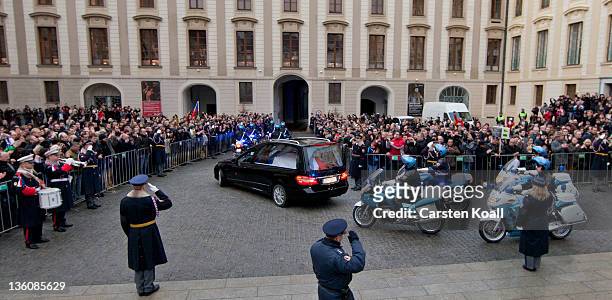 Hearse bears the coffin of former Czech President Vaclav Havel away past moruners and Prague Castle guards following Havel's state funeral at St....