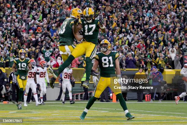 Allen Lazard and Davante Adams of the Green Bay Packers celebrate after Lazard caught a touchdown pass in the first quarter against the Cleveland...