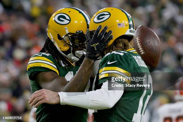 Davante Adams and Aaron Rodgers of the Green Bay Packers celebrate after scoring a touchdown in the second quarter against the Cleveland Browns at...