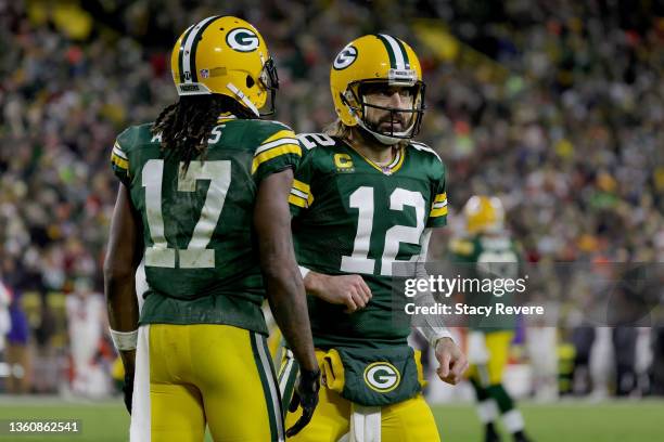 Davante Adams and Aaron Rodgers of the Green Bay Packers celebrate after scoring a touchdown in the second quarter against the Cleveland Browns at...