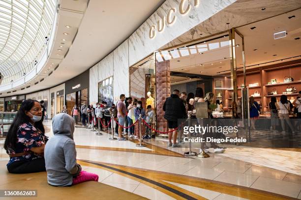 Shoppers line up outside Gucci at Chadstone The Fashion Capital during the Boxing Day sales on December 26, 2021 in Melbourne, Australia. Australians...