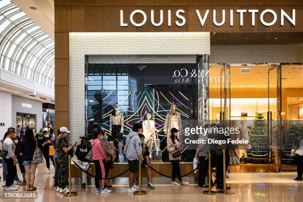 Shoppers line up outside Louis Vuitton at Chadstone The Fashion Capital during the Boxing Day sales during the Boxing Day sales on December 26, 2021...