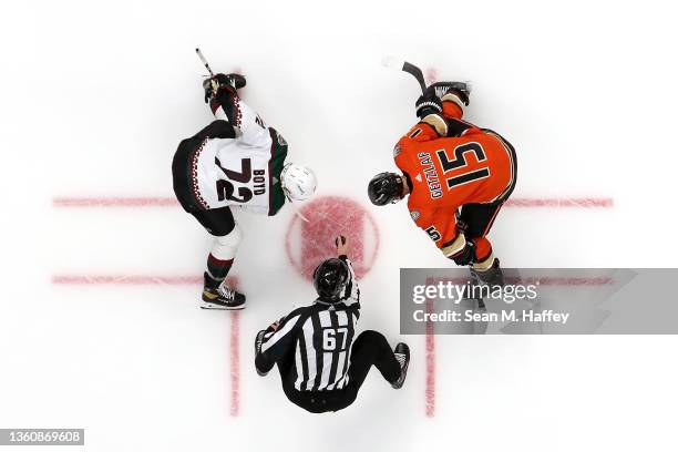 Ryan Getzlaf of the Anaheim Ducks faces off against Travis Boyd of the Arizona Coyotes during the third period of a game at Honda Center on December...