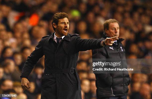 Manager of Chelsea Andre Villas-Boas gives instructions with Tottenham manager Harry Redknapp during the Barclays Premier League match between...