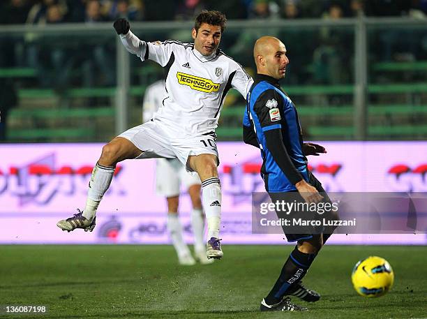 Adrian Mutu of AC Cesena is challenged by Michele Ferri of Atalanta BC during the Serie A match between Atalanta BC and AC Cesena at Stadio Atleti...