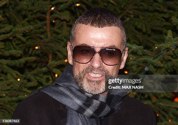 British singer George Michael talks about his recent illness outside his home in Hampstead in London on December 23, 2011. George Michael fought back...