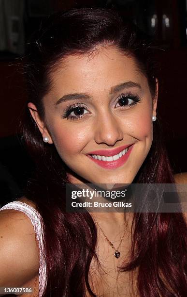 Ariana Grande promotes her new Universal/Republic cd "Put Your Hearts Up" as she visits Planet Hollywood Times Square on December 22, 2011 in New...