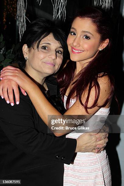 Joan Grande and daughter Ariana Grande pose at Planet Hollywood Times Square on December 22, 2011 in New York City.