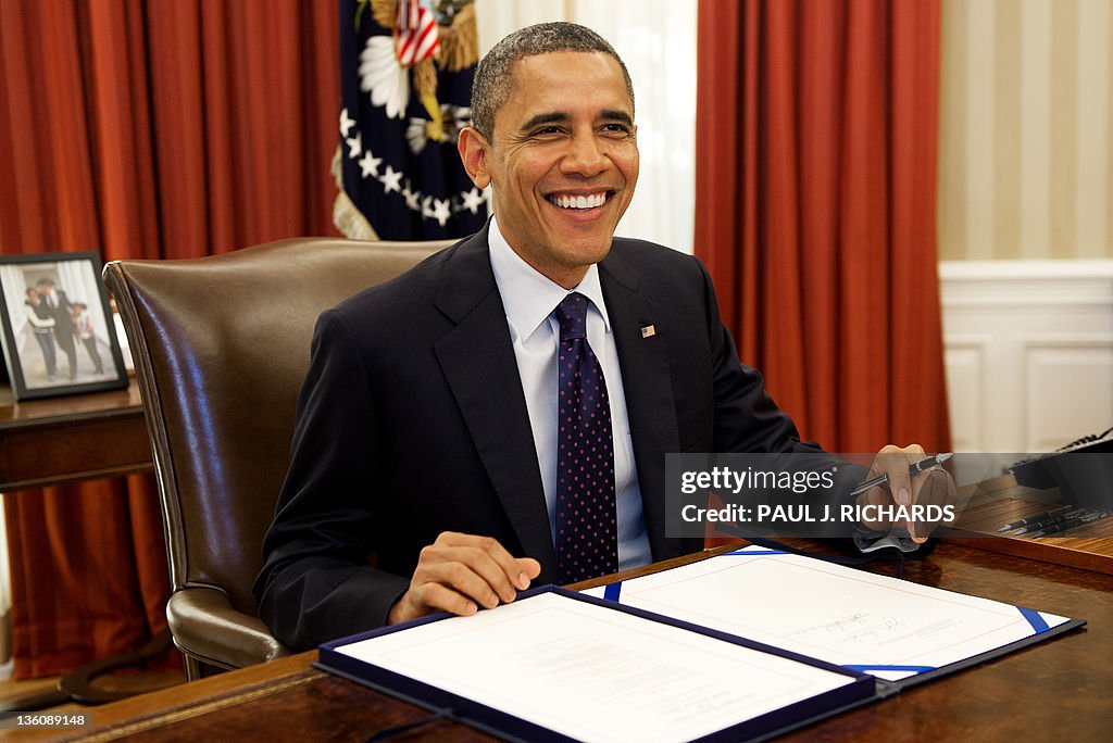 US President Barack Obama smiles as he s