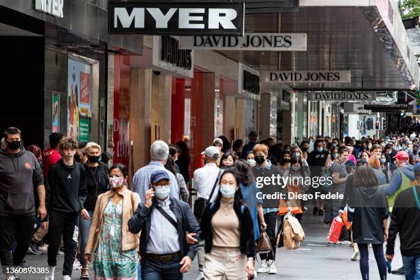 People walk along Bourke Street Mall during the Boxing Day sales on December 26, 2021 in Melbourne, Australia. Australians celebrate Boxing Day with...