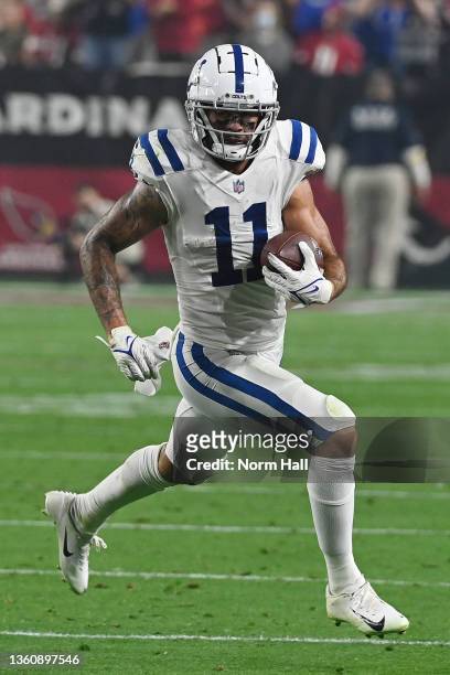 Michael Pittman of the Indianapolis Colts runs with the ball after a reception against the Arizona Cardinals during the third quarter at State Farm...