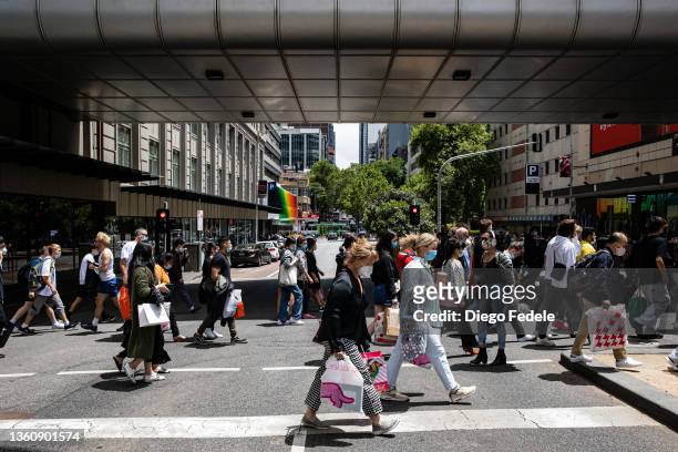 People walk along Lonsdale Street during the Boxing Day sales on December 26, 2021 in Melbourne, Australia. Australians celebrate Boxing Day with...