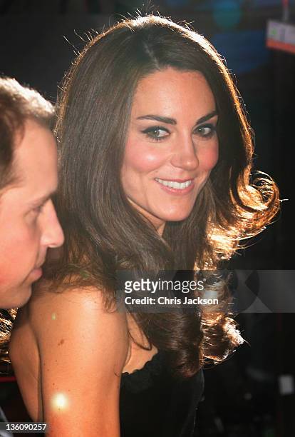 Catherine, Duchess of Cambridge looks towards Prince William, Duke of Cambridge as they attend the Sun Military Awards at the Imperial War Museum on...