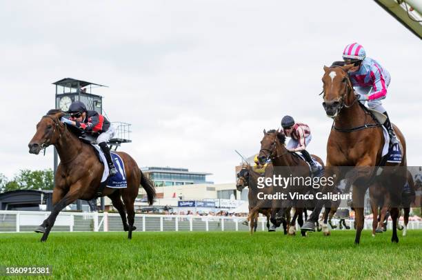 Jamie Kah riding Marabi defeats Jye McNeil riding Away Game in Race 8, the Nick Johnstone Christmas Stakes, during Melbourne Racing at Caulfield...