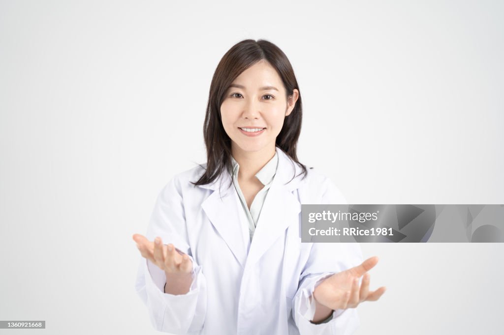 Image of a female doctor explaining online medical treatment through a computer screen White background