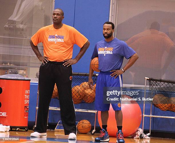 Assistant Coach Herb Williams of the New York Knicks with player Baron Davis during practice on December 19, 2011 at the Madison Square Garden...