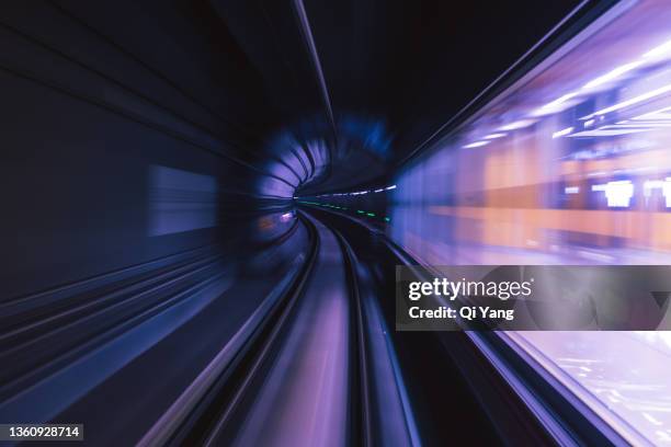 long exposure of subway tunnel - bullet trains stockfoto's en -beelden