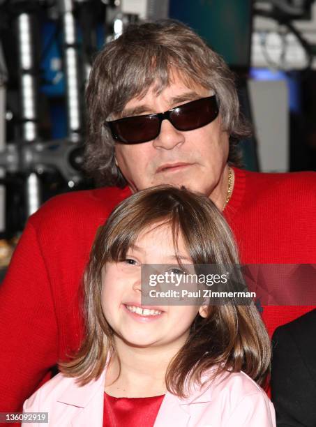 Musician Jose Feliciano and Make-A-Wish Child Katherine Mara pose after ringing the closing bell at the New York Stock Exchange on December 23, 2011...