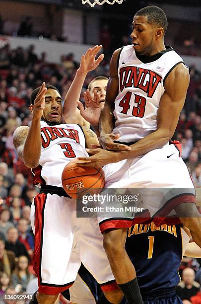 Anthony Marshall and Mike Moser of the UNLV Rebels go after a rebound against the California Golden Bears during their game at the Thomas & Mack...