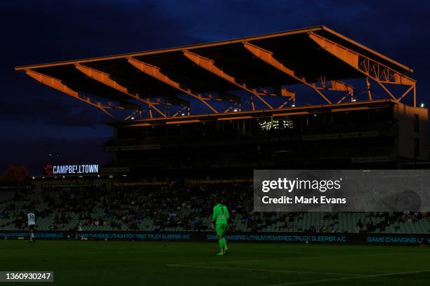 The late evening sun lights up a grandstand during the A-League Men's match between Macarthur FC and Sydney FC at Campbelltown Stadium, on December...