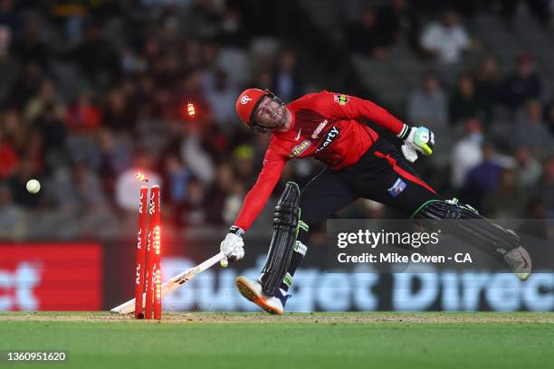 Mackenzie Harvey of the Renegades is run out by Laurie Evans of the Scorchers during the Men's Big Bash League match between the Perth Scorchers and...