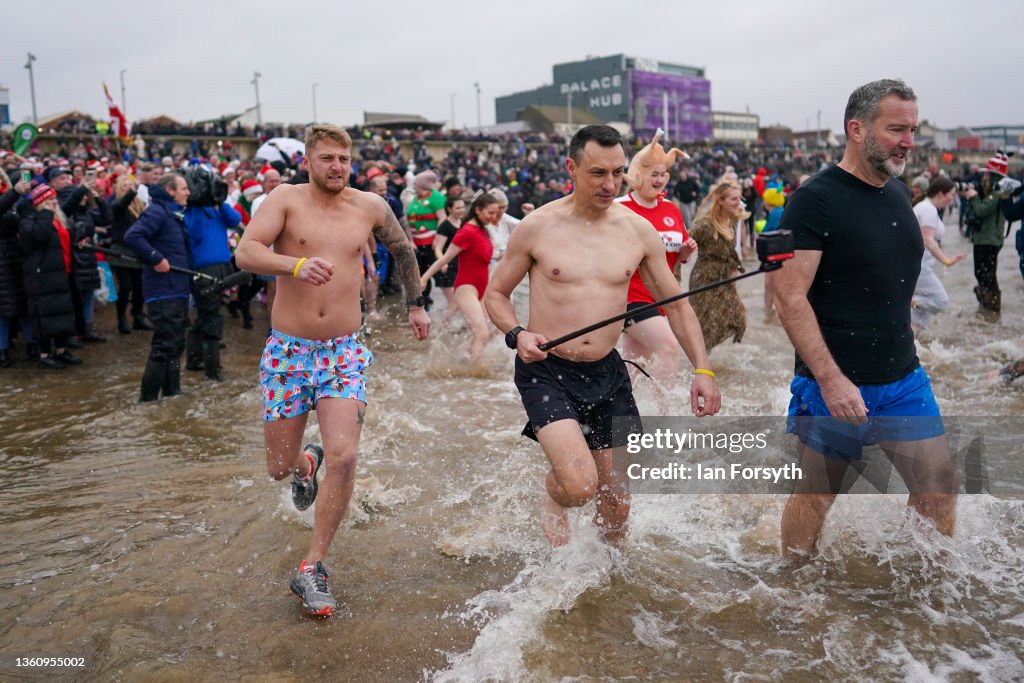 People Take To The Water For Redcar Boxing Day Dip