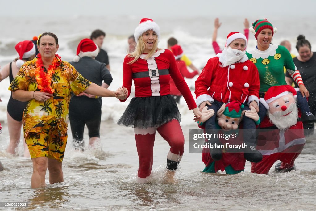 People Take To The Water For Redcar Boxing Day Dip