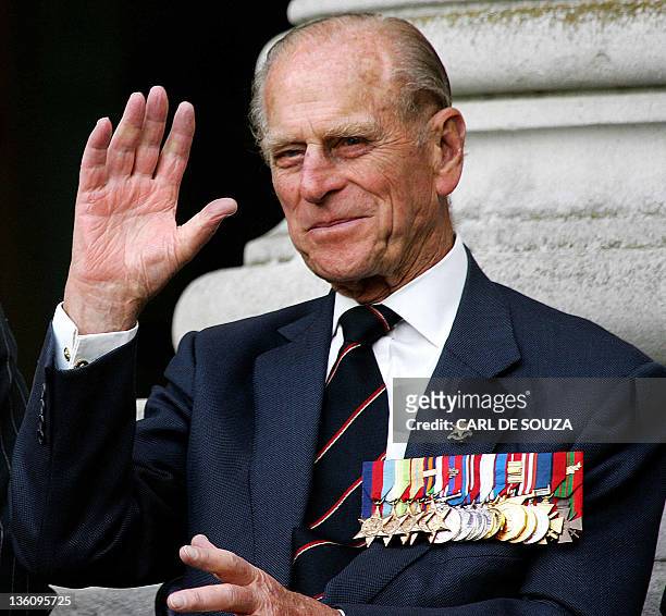 Prince Philip the Duke of Edinburgh, who served with the British Pacific Fleet waves to the Band of the Brigade of Gurkhas during a ceremony to mark...