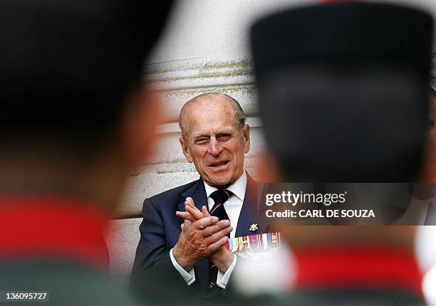 Prince Philip the Duke of Edinburgh, who served with the British Pacific Fleet applauds the Band of the Brigade of Gurkhas during a ceremony to mark...