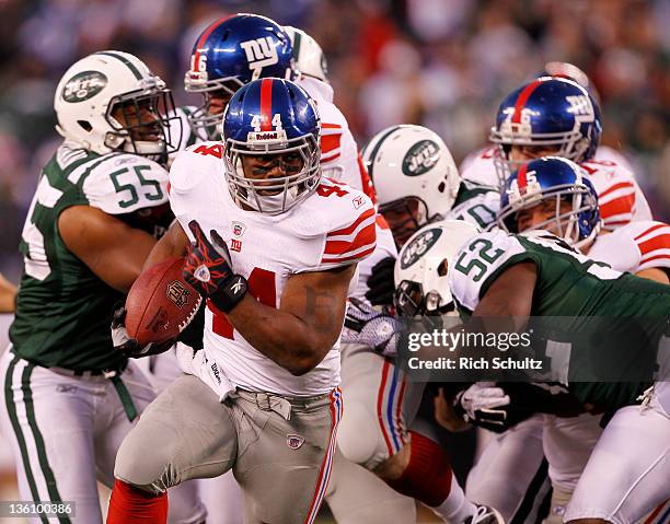 Ahmad Bradshaw of the New York Giants runs for his second touchdown against the New York Jets in a game at MetLife Stadium on December 24, 2011 in...