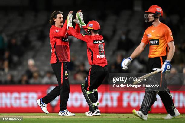 Nic Maddinson and Sam Harper of the Renegades celebrate a wicket during the Men's Big Bash League match between the Perth Scorchers and the Melbourne...