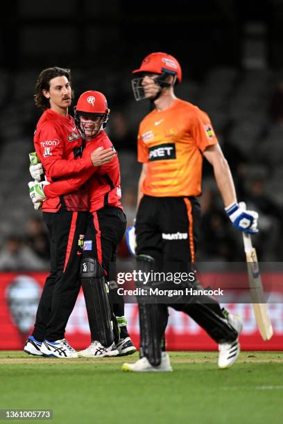 Nic Maddinson and Sam Harper of the Renegades celebrate a wicket during the Men's Big Bash League match between the Perth Scorchers and the Melbourne...